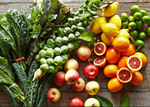 a group of fruits and vegetables on a wood surface Healthy Weight Loss Diets Wilmslow
