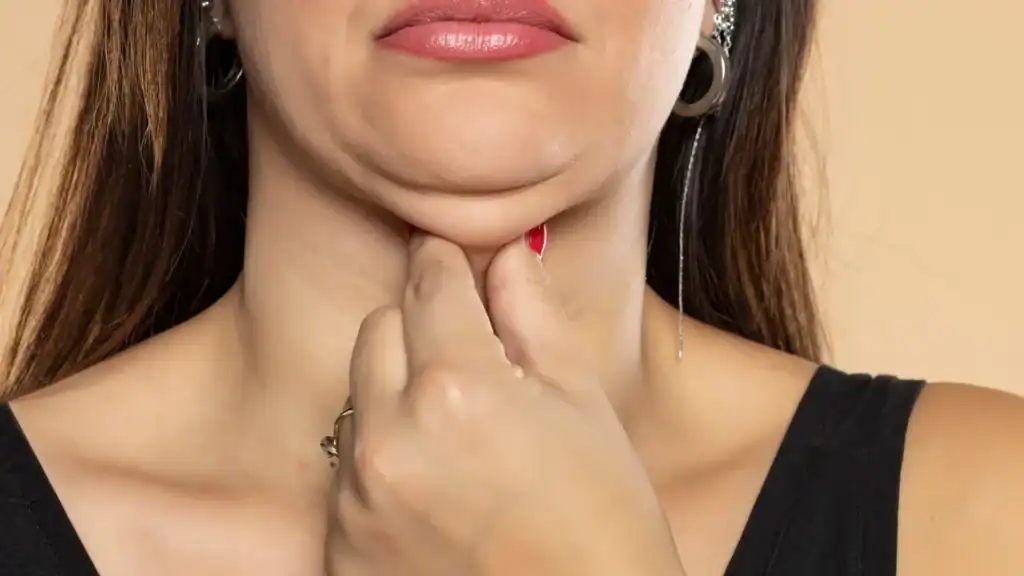 An image of a woman with double chin, sad, worried : Non Surgical Double Chin Removal Treatment in Wilmslow, UK